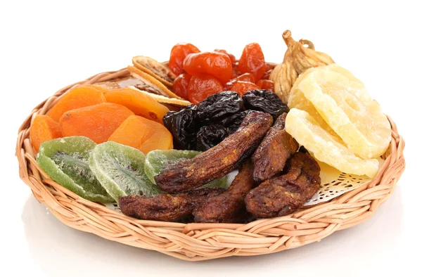 Dried fruits on wicker plate isolated on white — Stock Photo, Image