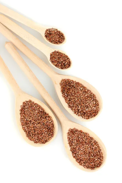 Semillas de lino en cucharas de madera sobre fondo blanco de cerca — Foto de Stock