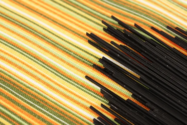 Black spaghetti on light background — Stock Photo, Image