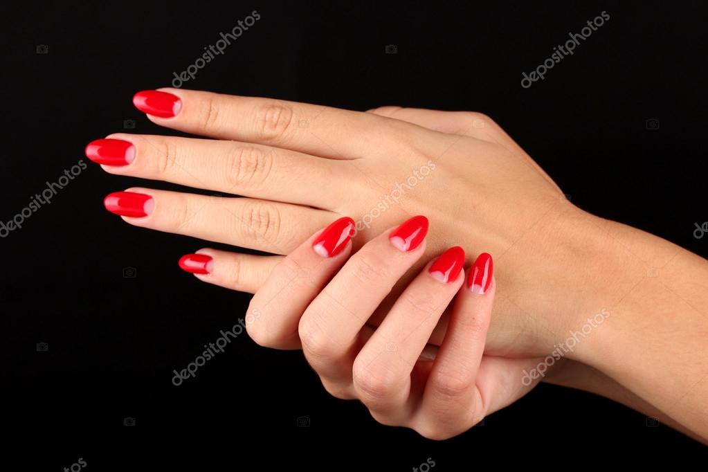 Manicure. Beautiful manicured woman's hands with red nail polish. Beautiful  red manicure. Girl with red nail Polish on the nails. Bright red polish on  nails and holding red rose Stock Photo by ©