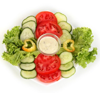 Chopped vegetables and sauce on plate isolated on white