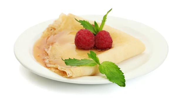 Delicious pancake with berries and honey on plate on wooden table — Stock Photo, Image