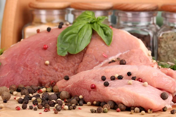 A large piece of pork marinated with herbs and spices close-up — Stock Photo, Image