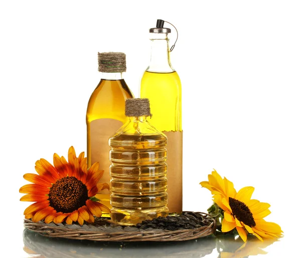 Olio in bottiglie, girasoli e semi isolati su bianco — Foto Stock