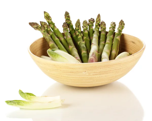 Fresh asparagus in wooden bowl isolated on white — Stock Photo, Image