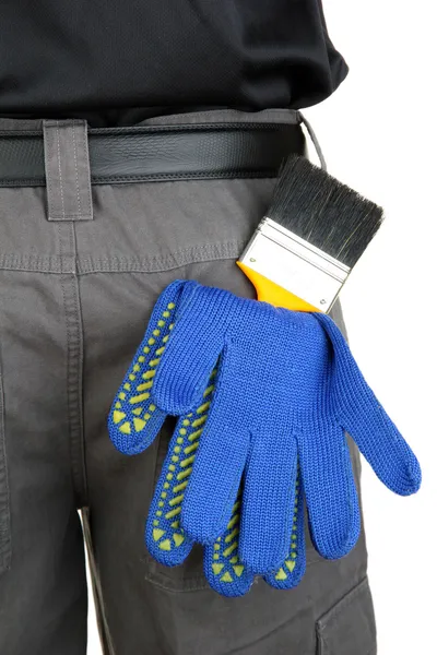 Кисть и перчатки в заднем кармане крупным планом — стоковое фото