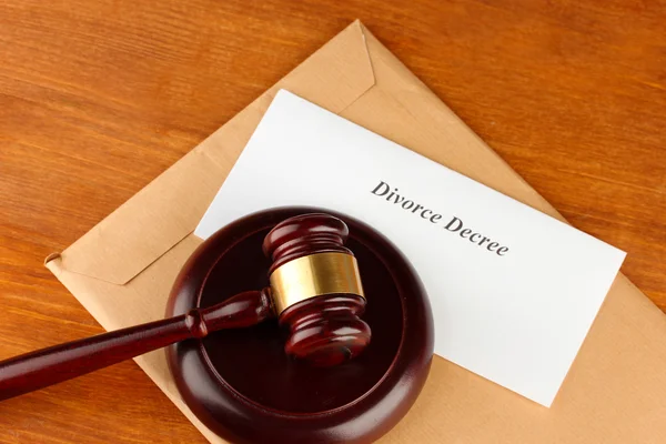 Divorce decree and wooden gavel on wooden background — Stock Photo, Image