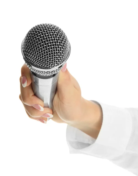 Mano femenina con micrófono aislado en blanco —  Fotos de Stock
