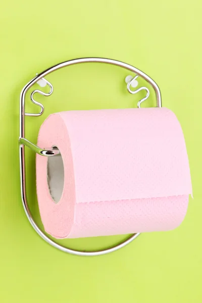 Roll of toilet paper on holder fixed to wall — Stock Photo, Image