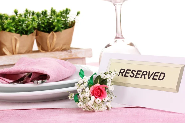 Table setting with reserved card in restaurant — Stock Photo, Image