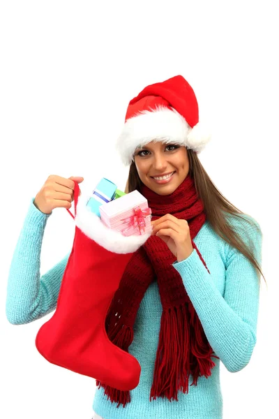 Hermosa mujer joven sosteniendo calcetín de Navidad con regalos, aislado en blanco —  Fotos de Stock