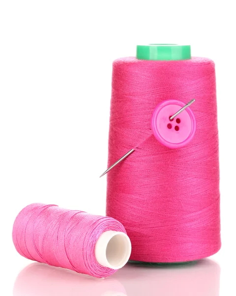 Pink bobbin with needle and buttons isolated on white — Stock Photo, Image