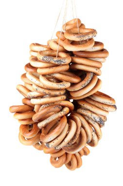 Lezzetli simitler ipte, beyaz üzerinde izole edilmiş