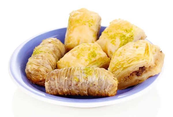 Sweet baklava on plate isolated on white — Stock Photo, Image