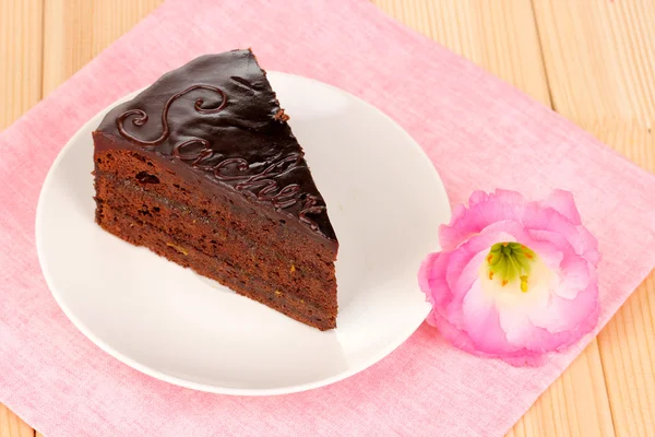 Chocolate sacher cake on wooden table — Stock Photo, Image