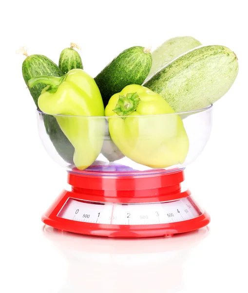 Fresh green vegetables in scales isolated on white — Stock Photo, Image