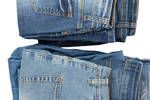 Twee stapels mode blue jeans close-up geïsoleerd op wit — Stockfoto