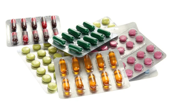 Tobolky a pilulky balené v blistrech, izolované na bílém — Stock fotografie