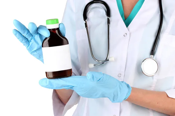 Doctor with bottle isolated on white — Stock Photo, Image