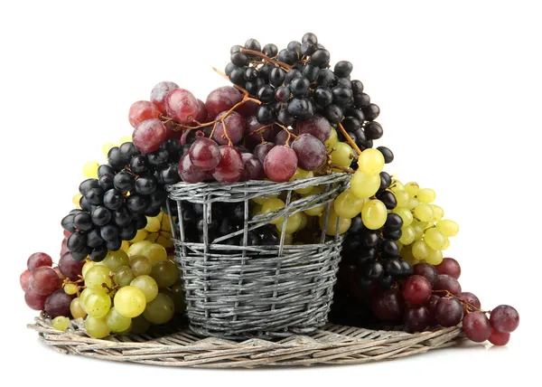Assortment of ripe sweet grapes in basket, isolated on white — Stock Photo, Image
