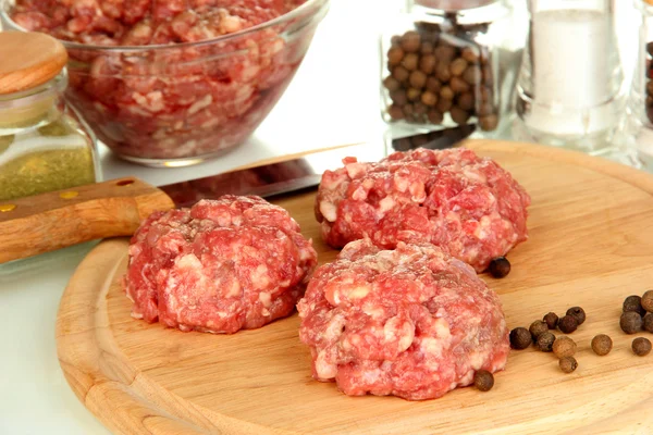 Raw meatballs with spices — Stock Photo, Image