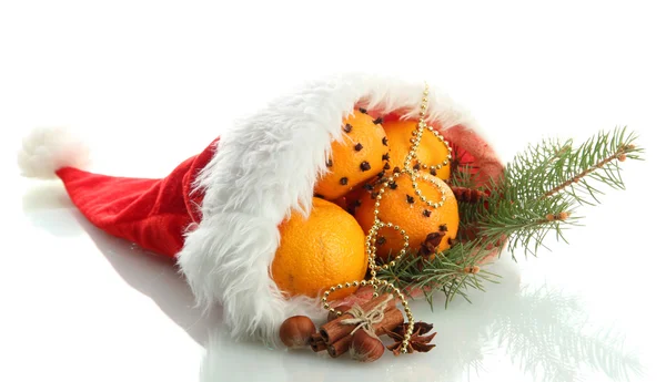 Christmas composition with oranges and fir tree in Santa Claus hat, isolated on white — Stock Photo, Image