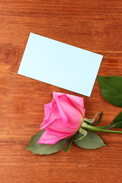 Beautiful rose on wooden background Royalty Free Stock Images