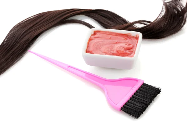Bowl with hair dye and pink brush on white background close-up Royalty Free Stock Photos
