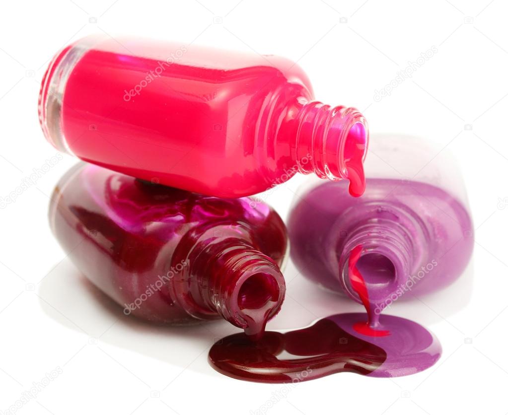 open bottles with bright nail polish isolated on white