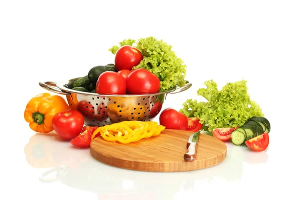 Fresh vegetables and knife on cutting board isolated on white — Stock Photo, Image