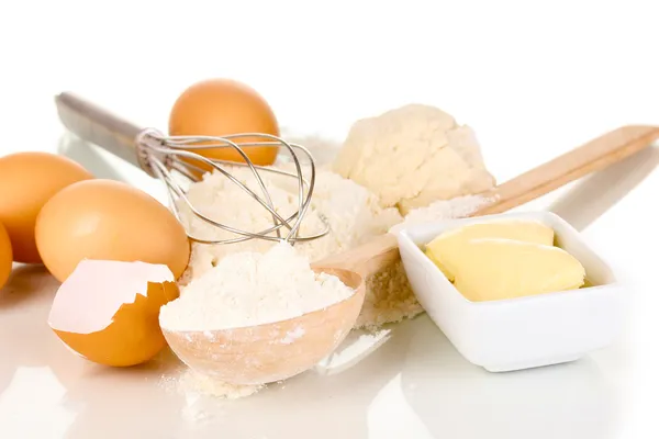 Eggs, flour and butter isolated on white — Stock Photo, Image