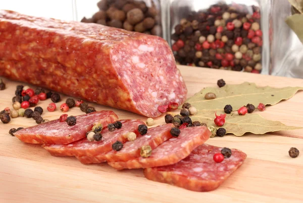 Tasty sausage on chopping board close-up — Stock Photo, Image
