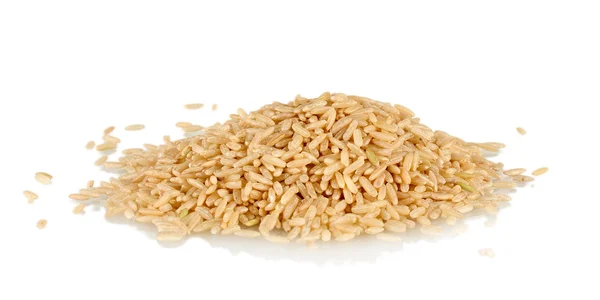 Brown rice uncooked in a heap isolated on a white background — Stock Photo, Image