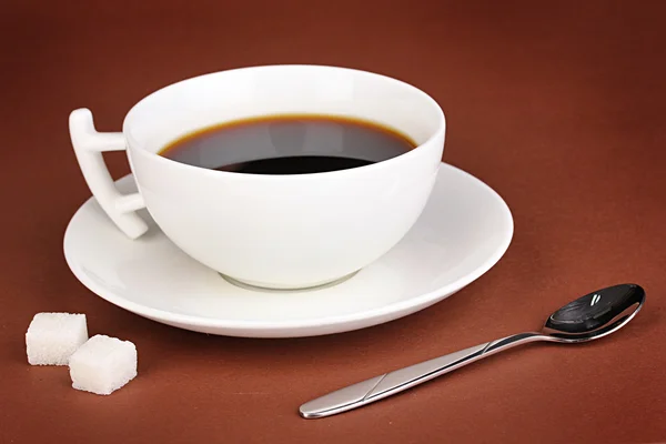 A cup of strong coffee on brown background — Stock Photo, Image