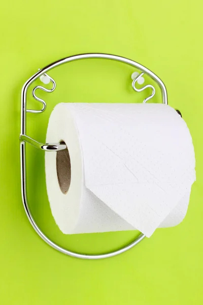 Roll of toilet paper on holder fixed to wall — Stock Photo, Image