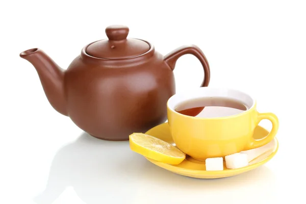 Yellow cup with saucer and teapot isolated on white — Stock Photo, Image