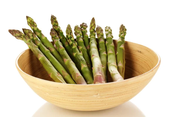 Fresh asparagus in wooden bowl isolated on white — Stock Photo, Image