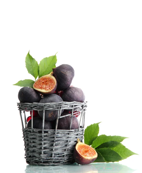 Ripe sweet figs with leaves in basket isolated on white — Stock Photo, Image