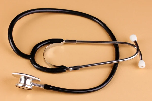 Stethoscope on beige background — Stock Photo, Image