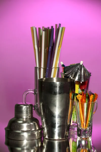 Cocktail shaker and other bartender equipment on color background — Stock Photo, Image