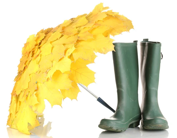 Maple leaves umbrella with green gumboots isolated on white — Stock Photo, Image