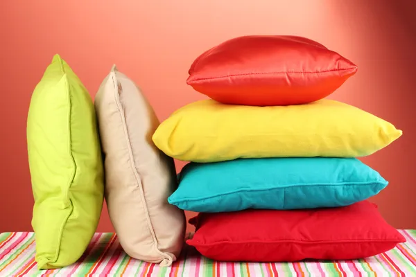 Pillows on red background — Stock Photo, Image