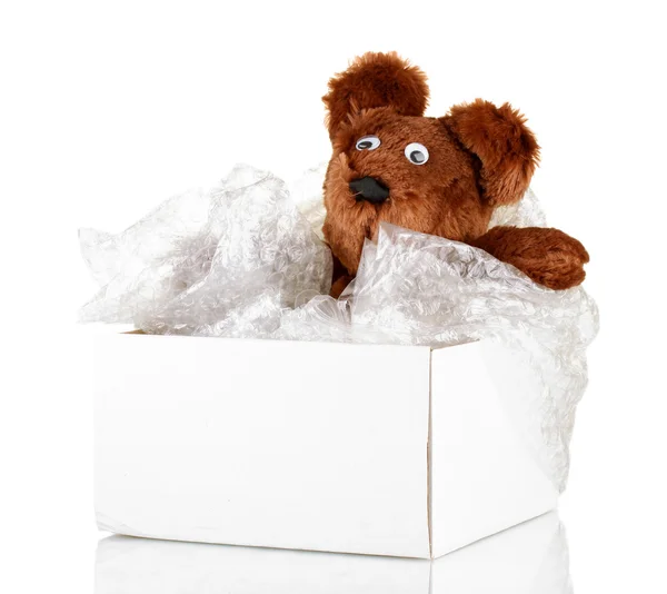 Paquete abierto con un juguete para niños aislado en blanco — Foto de Stock