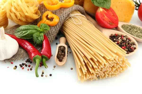 Pasta spaghetti, vegetables and spices, isolated on white — Stock Photo, Image