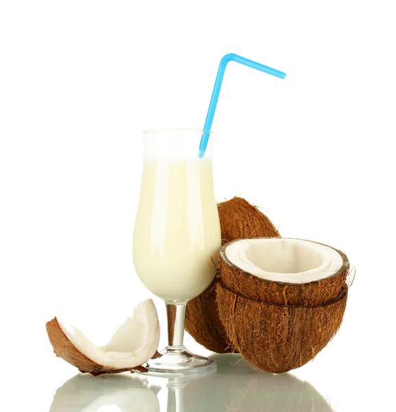 Glass of coconut milk and coconuts isolated on white — Stock Photo, Image