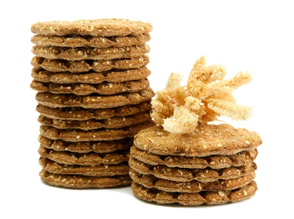 Saporito pane croccante e spighe, isolato su bianco — Foto Stock