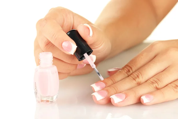 Woman makes herself a French manicure, on white background — Stock Photo, Image