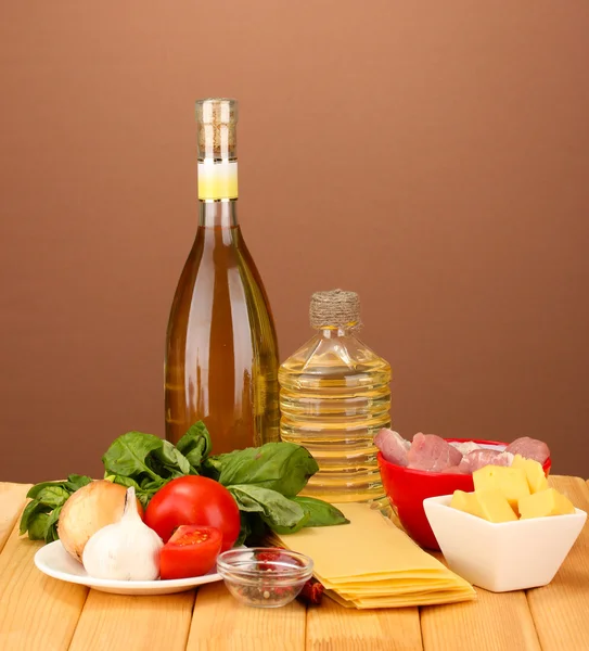Lasagna ingredients on brown background — Stock Photo, Image
