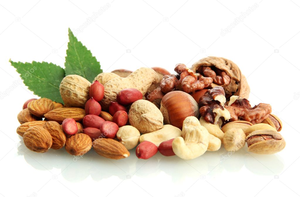 assortment of tasty nuts with leaves, isolated on white