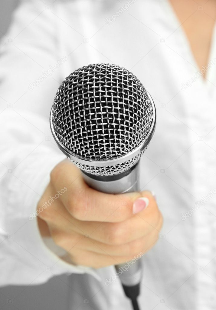 female with microphone, close up